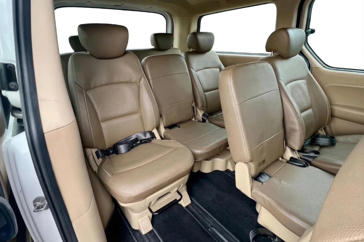 Spacious multi row passenger seats in Hyundai Starex 11 seater private car SG to JB