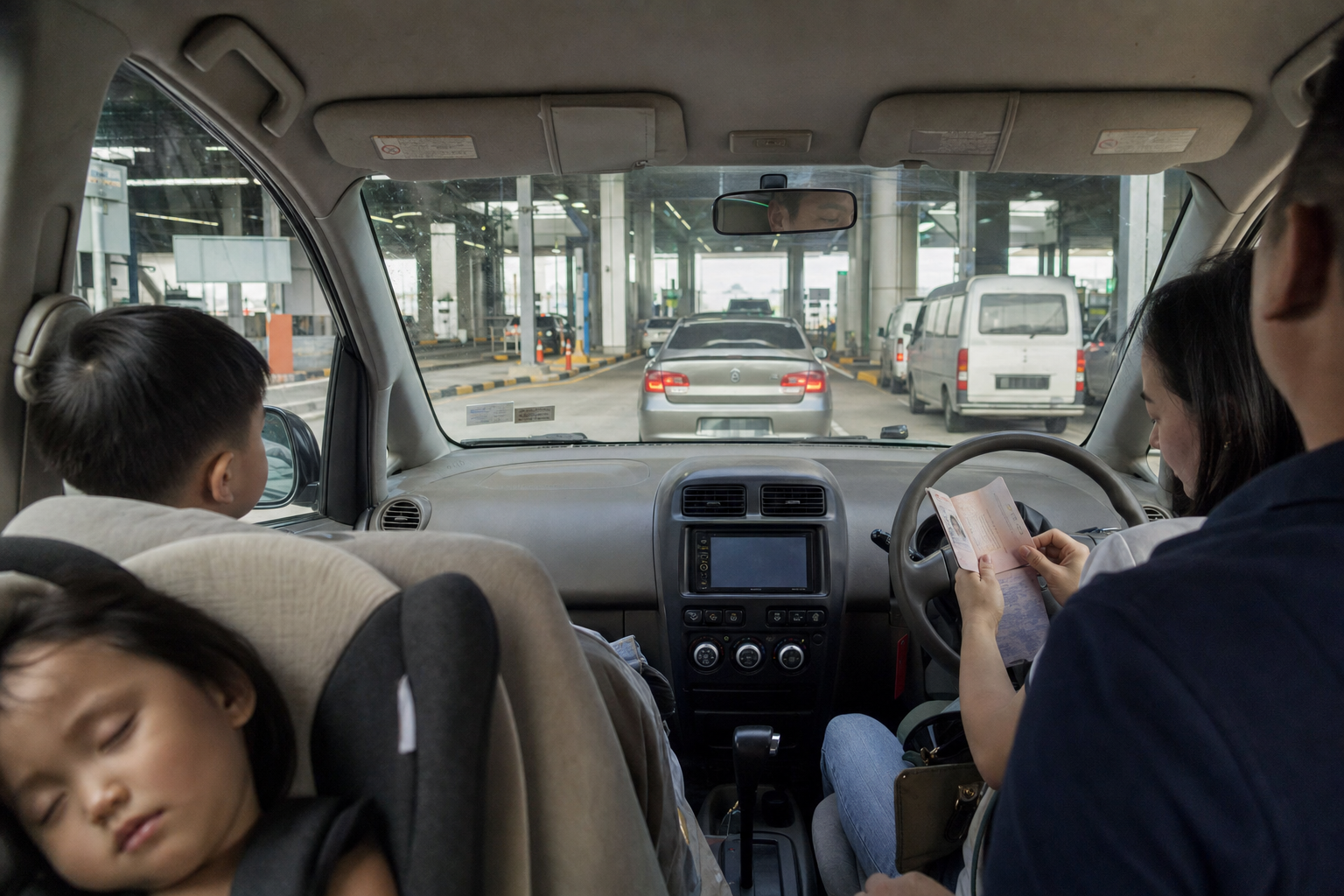Family staying in the car at Tuas Second Link on the way to Legoland